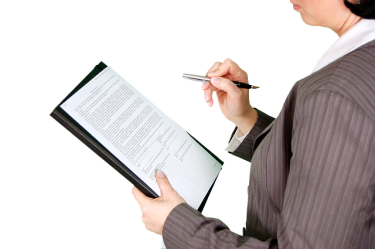 business woman filing out a form