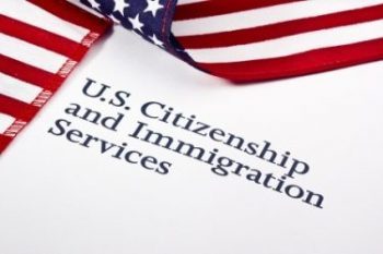 U.S. Citizenship and Immigration Services with U.S. flag