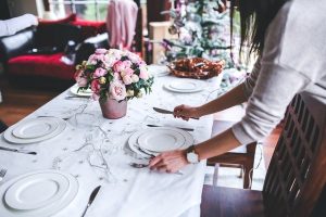 Woman setting up fancy table
