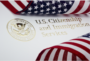 U.S. Citizenship and Immigration Services file and and American flag